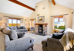 The living room and log fire at Cartmel Hill